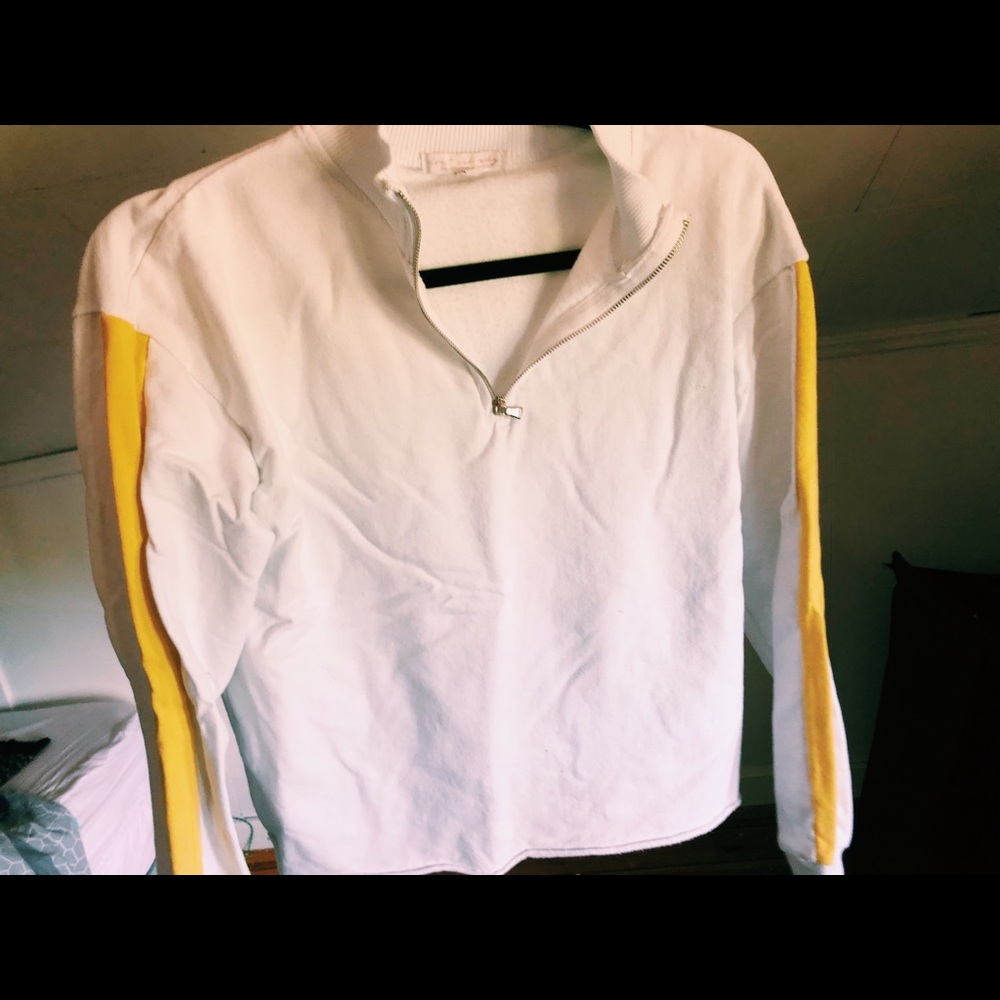White and yellow sweatshirt.